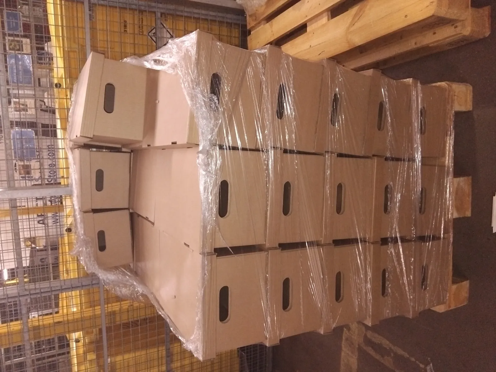 Shrink-wrapped pallet of heavy cartons moved same-day by a dedicated Red Eagle Logistics courier